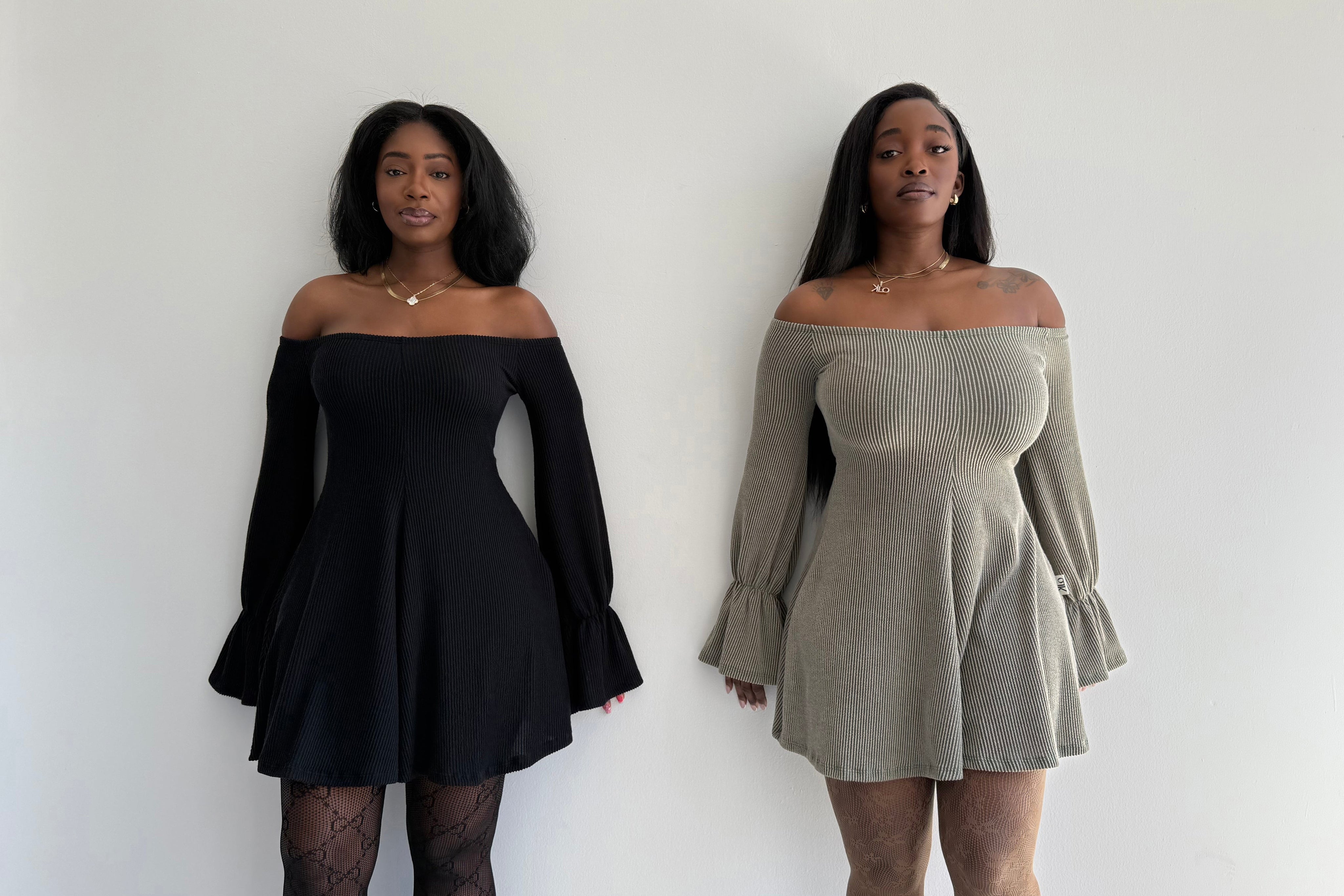 Two women wearing off-shoulder dresses against a white background